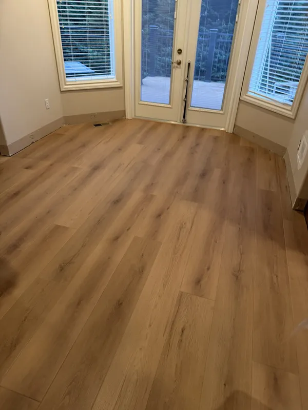 Oak floor in a bay windowed room with french doors onto the garden