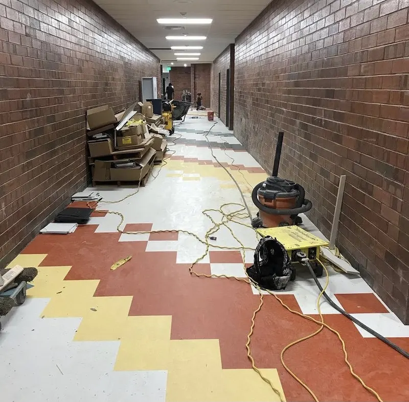 Patterned vinyl tile laid the length of a commercial corridor